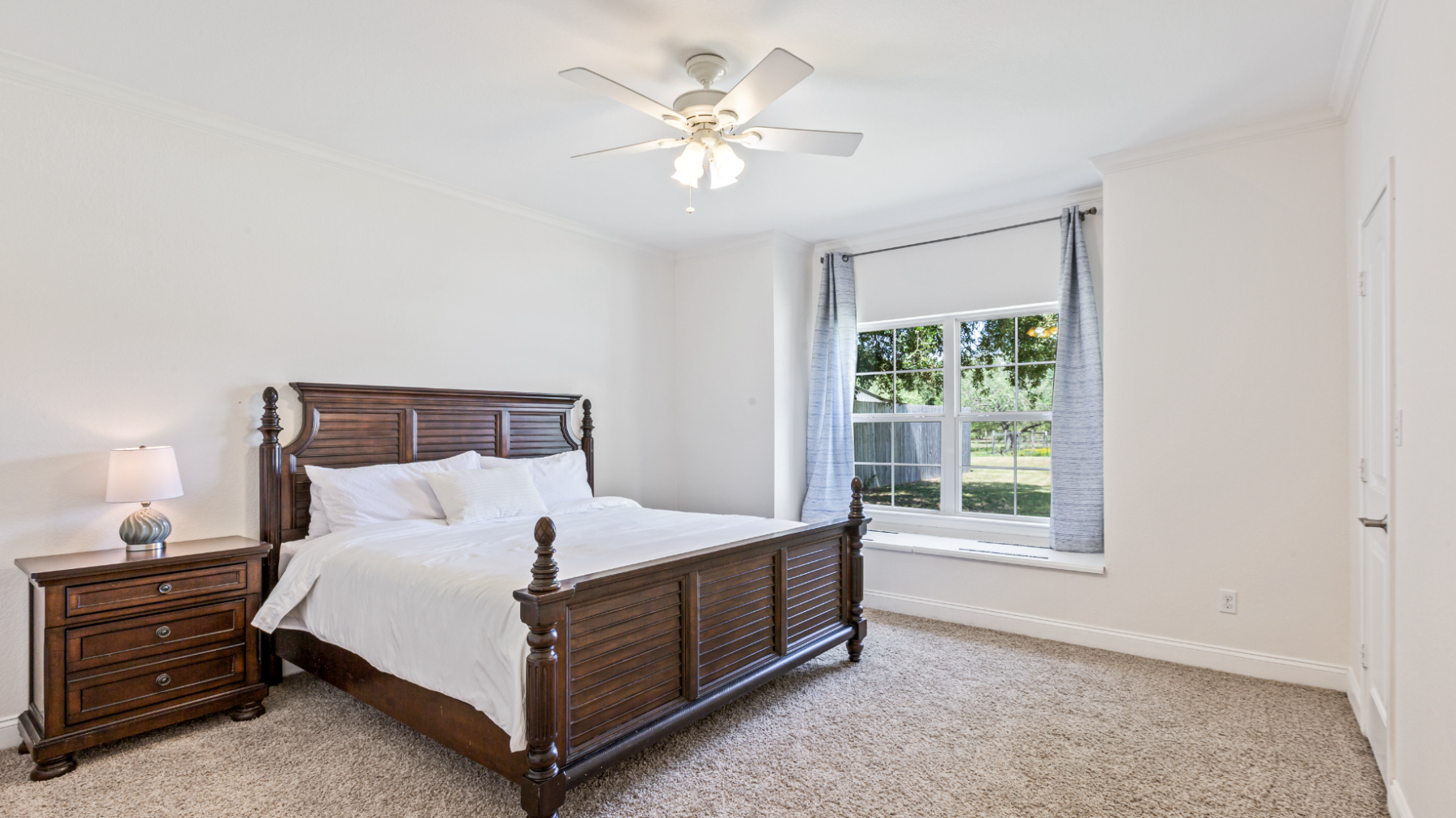 a bedroom with a bed in a room